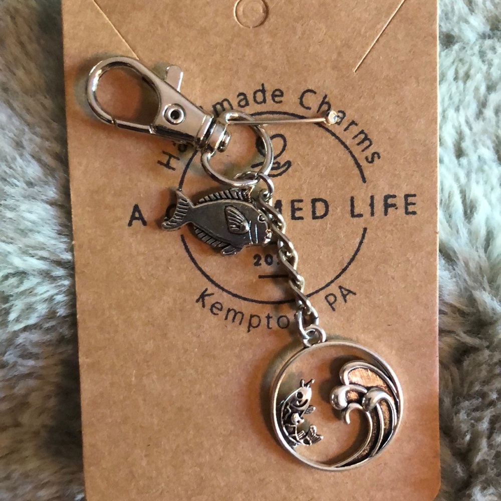 NWT, Handcrafted by A Charmed Life. Silver Luggage Zipper Pull.
